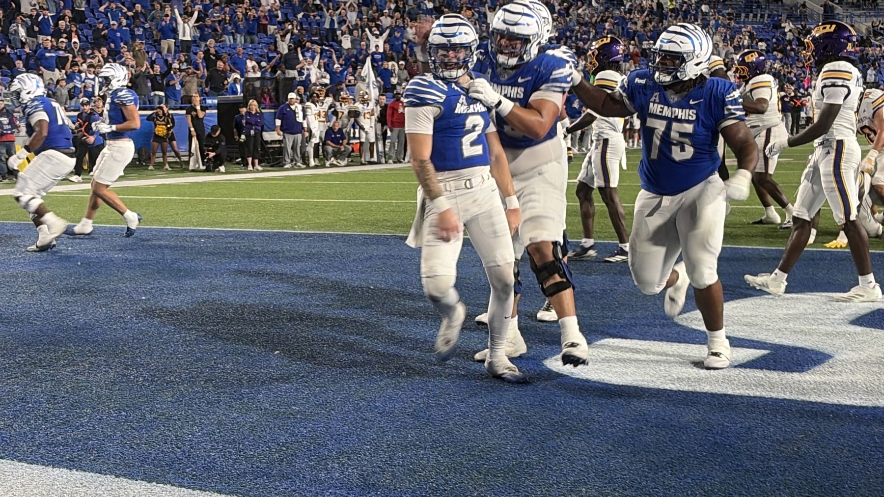 Game action between Memphis and East Carolina